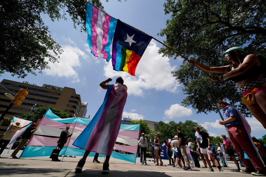 FILE - Demonstrators gather on the steps to the Texas Capitol to speak against transgender-related legislation bills being considered in the Texas Senate and House, May 20, 2021, in Austin, Texas. The Texas Supreme Court will allow the new state law banning gender-affirming care for minors to take effect on Friday, Sept. 1, 2023, setting up Texas to be the most populous state with such restrictions on transgender children. (AP Photo/Eric Gay, File)