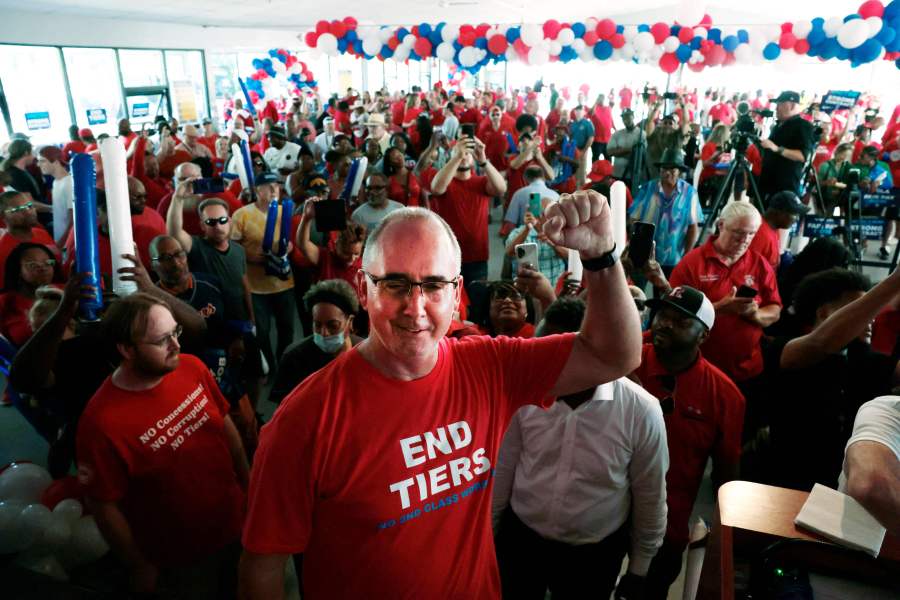 UAW President Shawn Fain with members.