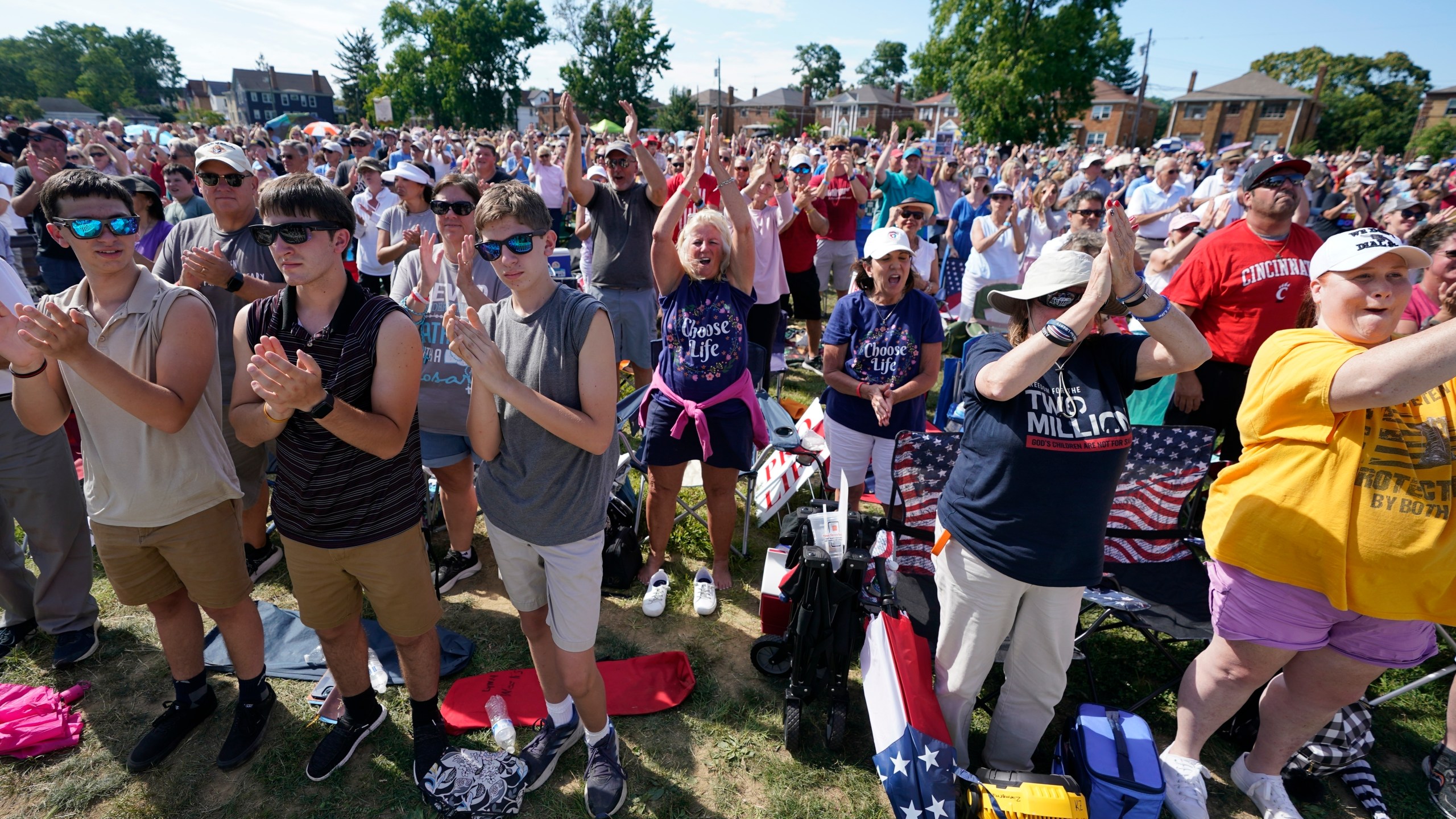 FILE - A crowd cheers as Jim Caviezel speaks during a "rosary rally" on Sunday, Aug. 6, 2023, in Norwood, Ohio. As the campaigning for and against the nation’s latest tug-of-war over abortion begins in earnest this weekend, Ohio voters are getting a different message from the measure’s opponents. (AP Photo/Darron Cummings, File)