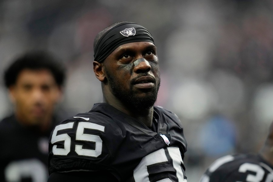 FILE - Las Vegas Raiders defensive end Chandler Jones (55) warms up before an NFL football game against the New England Patriots, Monday, Dec. 19, 2022, in Las Vegas. Las Vegas Raiders defensive end Chandler Jones indicated in since-deleted social media posts on Tuesday, Sept. 5, 2023, that he no longer wanted to play for coach Josh McDaniels and general manager David Ziegler.(AP Photo/John Locher, File)