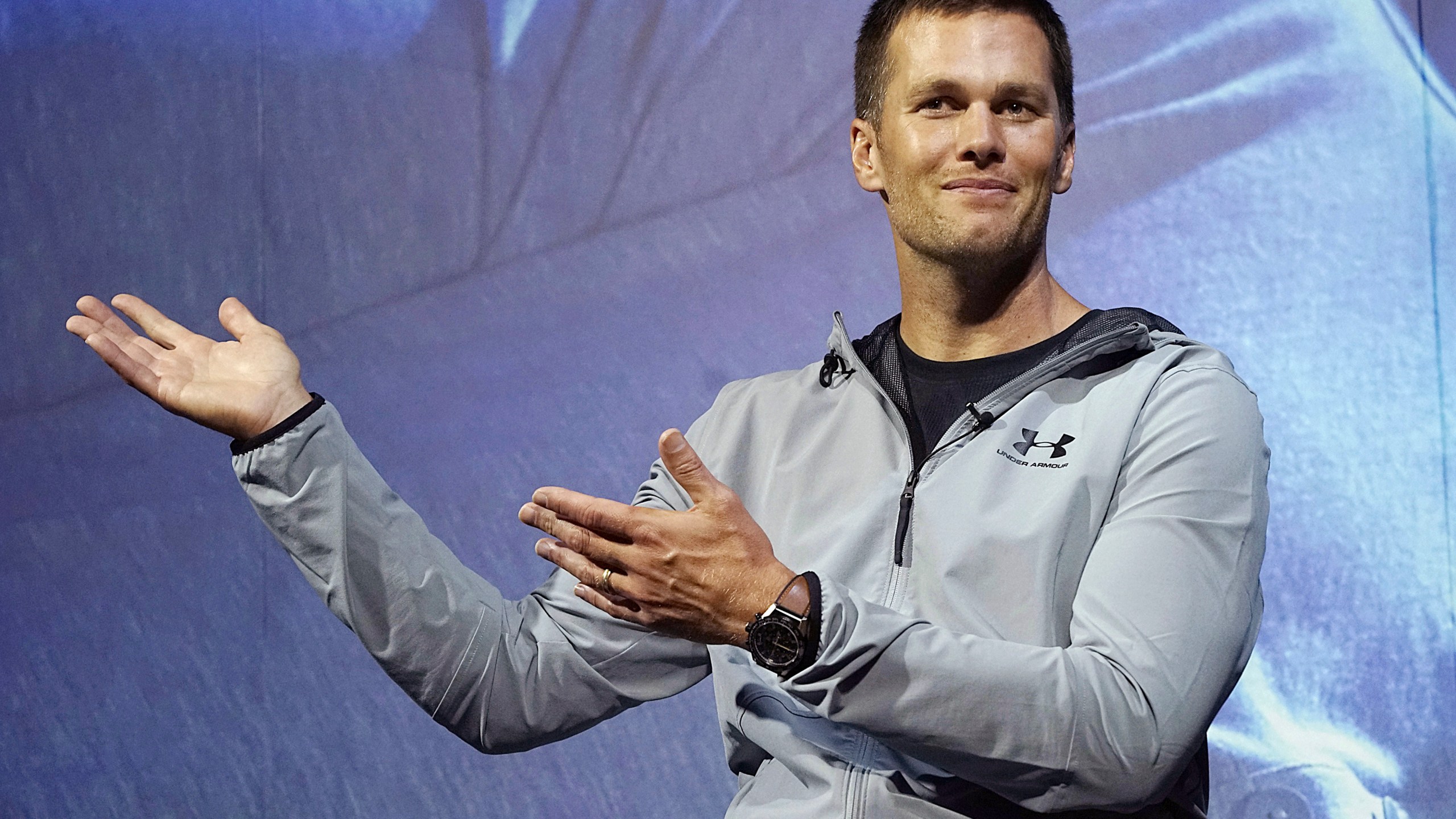 FILE - New England Patriots quarterback Tom Brady gestures during a promotional event, June 22, 2017, in Tokyo. Brady is putting on a Delta Air Lines uniform, at least figuratively. Delta said Wednesday, Sept. 6, 2023, that it has agreed to bring the former star quarterback on board as a long-term strategic adviser. (AP Photo/Eugene Hoshiko, File)