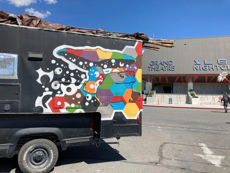 A painted vehicle sits in the Grand Sierra Resort and Casino parking lot in Reno, Nev., on Wednesday, Sept. 6, 2023. More than 100 RVs, campers and converted buses were parked Wednesday afternoon as the last of the Burning Man celebrants made their way journey back from the Black Rock Desert 100 miles to the north. (AP Photo/Scott Sonner)