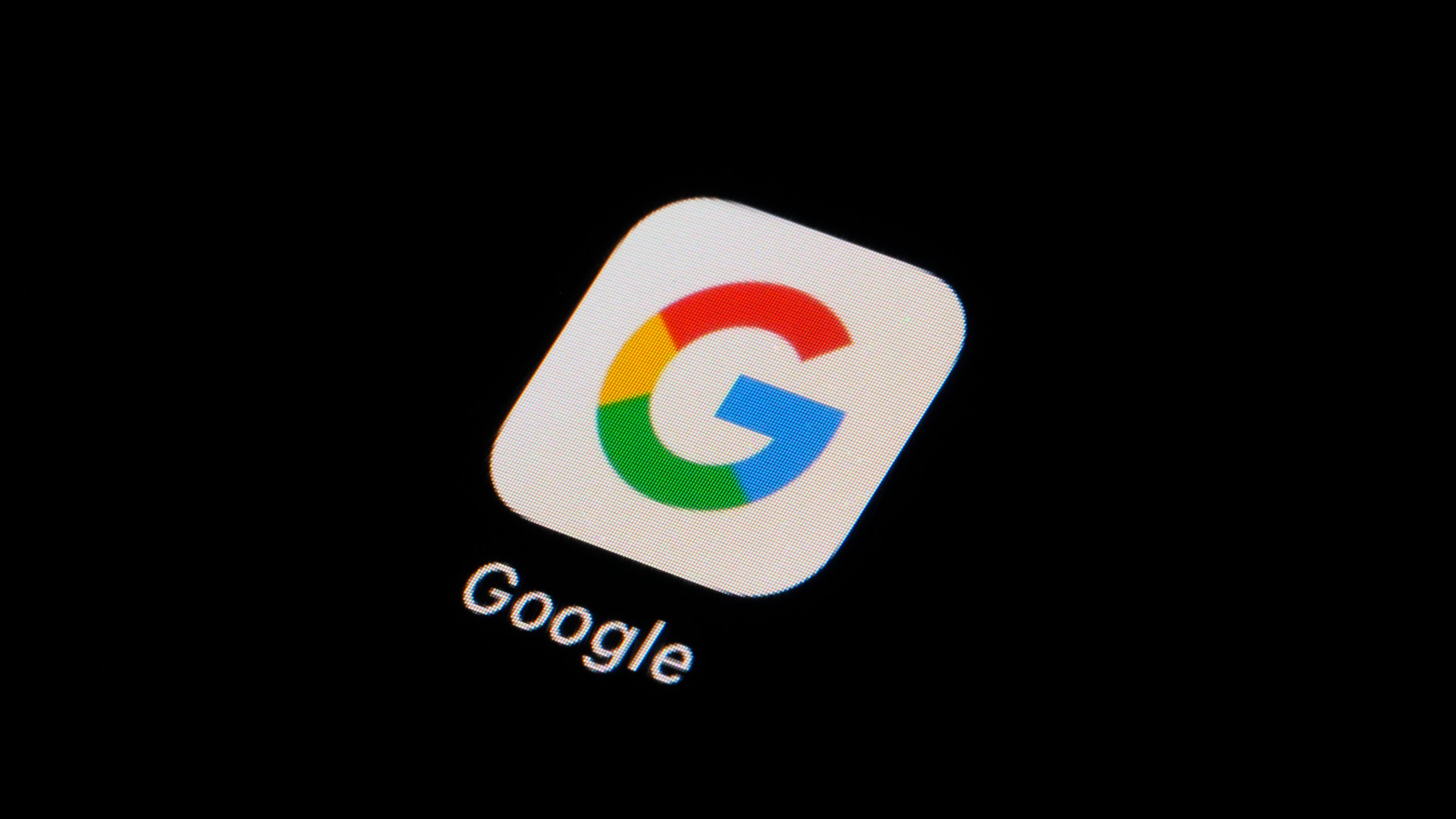 FILE - The Google app icon is seen on a smartphone, Tuesday, Feb. 28, 2023, in Marple Township, Pa. Google, on Thursday, Sept. 7, will soon require political advertising that incorporates artificial intelligence come with a prominent disclosure that the technology is being used to depict real or realistic-looking people or events. The use of AI has already begun to seep into that space and last month Federal Election Committee said that it may soon regulate AI-generated deepfakes in political ads ahead of the 2024 election.(AP Photo/Matt Slocum, File)