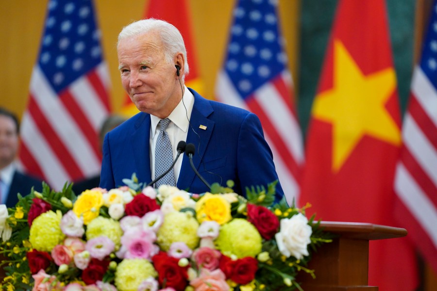 U.S. President Joe Biden and Vietnam's General Secretary Nguyen Phu Trong, unseen, deliver remarks after their meeting at the Communist Party of Vietnam Headquarters, in Hanoi, Vietnam, Sunday, Sept. 10, 2023. (AP Photo/Evan Vucci)