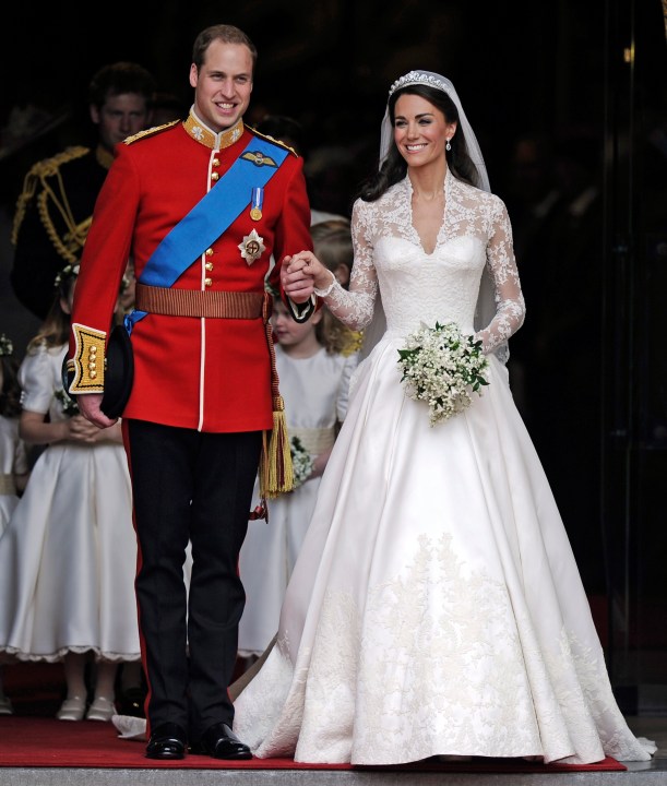 FILE - Britain's Prince William and his wife Kate, Duchess of Cambridge stand outside of Westminster Abbey after their Royal Wedding in London, on April, 29, 2011. The fashion designer who created the wedding dress of Kate, the Princess of Wales, is stepping down as creative director at Alexander McQueen after two decades at the brand, luxury group Kering said Monday Sept. 11, 2023. (AP Photo/Martin Meissner, File)