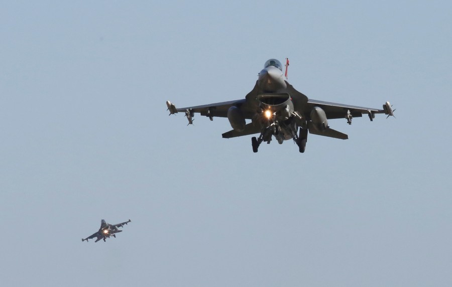 FILE - U.S. Air Force F-16 fighter jets fly over the Osan U.S. Air Base during a combined air force exercise with the United States and South Korea in Pyeongtaek, South Korea, Dec. 4, 2017. The U.S. could have the first Ukrainian pilots trained on F-16 fighter jets before the end of the year, though it will be longer than that before they are flying combat missions. That's according to the head of the Air National Guard force tasked with training them. (AP Photo/Ahn Young-joon, File)