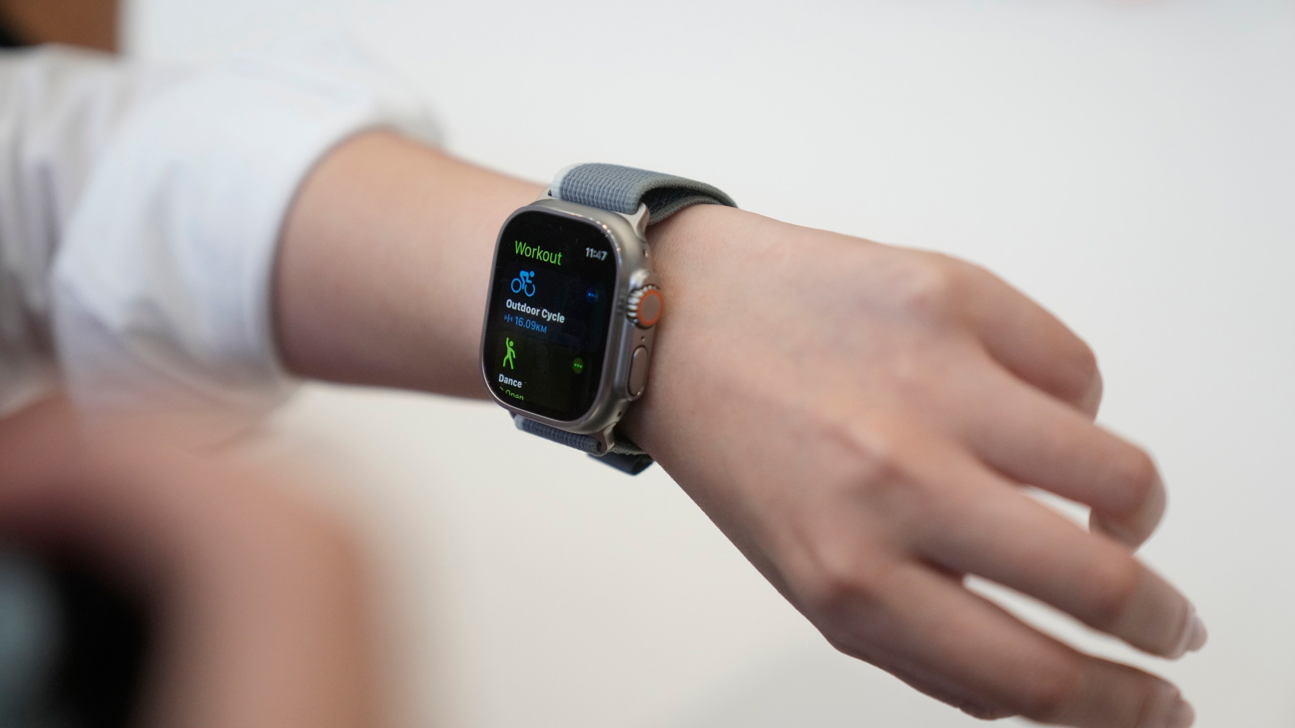 A person tries on an Apple Watch during an announcement of new products on the Apple campus, Tuesday, Sept. 12, 2023, in Cupertino, Calif. (AP Photo/Jeff Chiu)