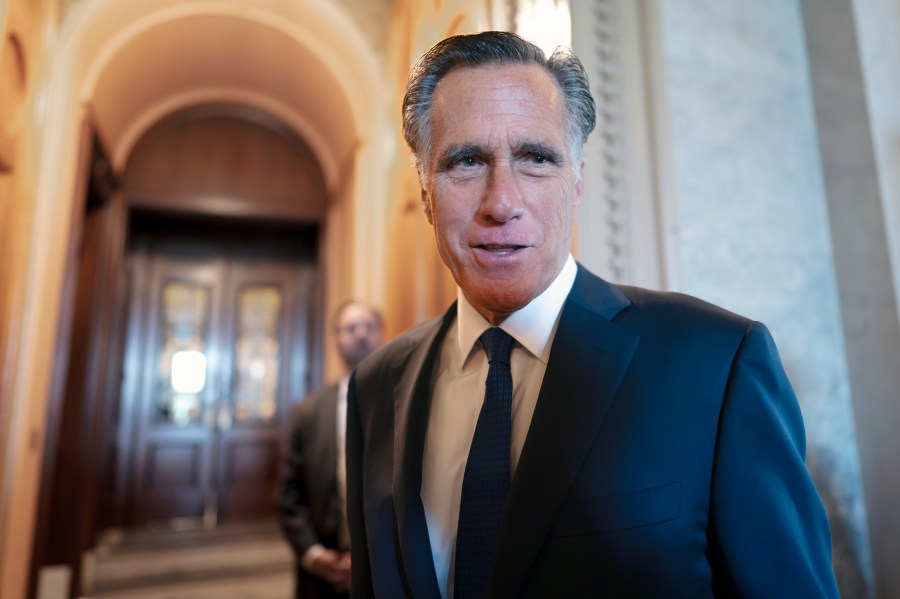 FILE - Sen. Mitt Romney, R-Utah, and other senators arrive at the chamber for votes, at the Capitol in Washington, Wednesday, Sept. 6, 2023. Romney will not run for reelection in 2024. The former presidential candidate and Massachusetts governor announced his intentions in a video statement Wednesday. (AP Photo/J. Scott Applewhite, File)