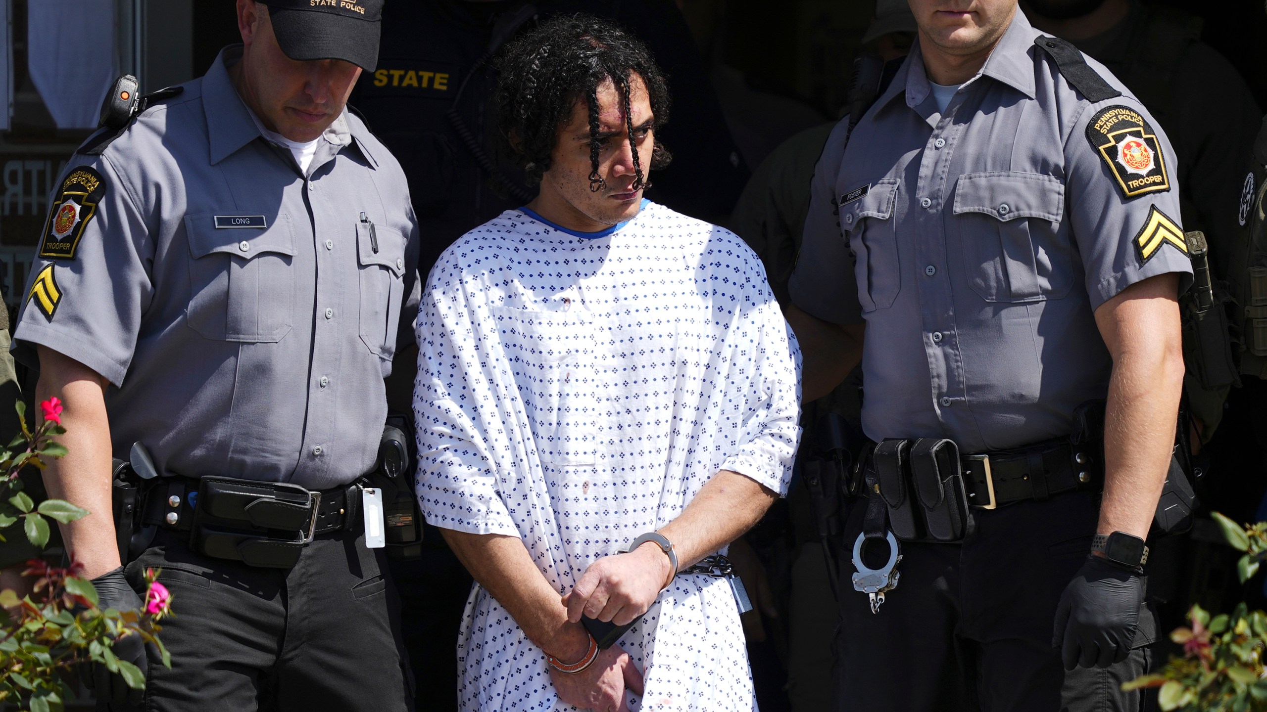 Law enforcement officers escort Danelo Cavalcante from a Pennsylvania State Police barracks in Avondale Pa., on Wednesday, Sept. 13, 2023. Cavalcante was captured Wednesday after eluding hundreds of searchers for two weeks. (AP Photo/Matt Rourke)