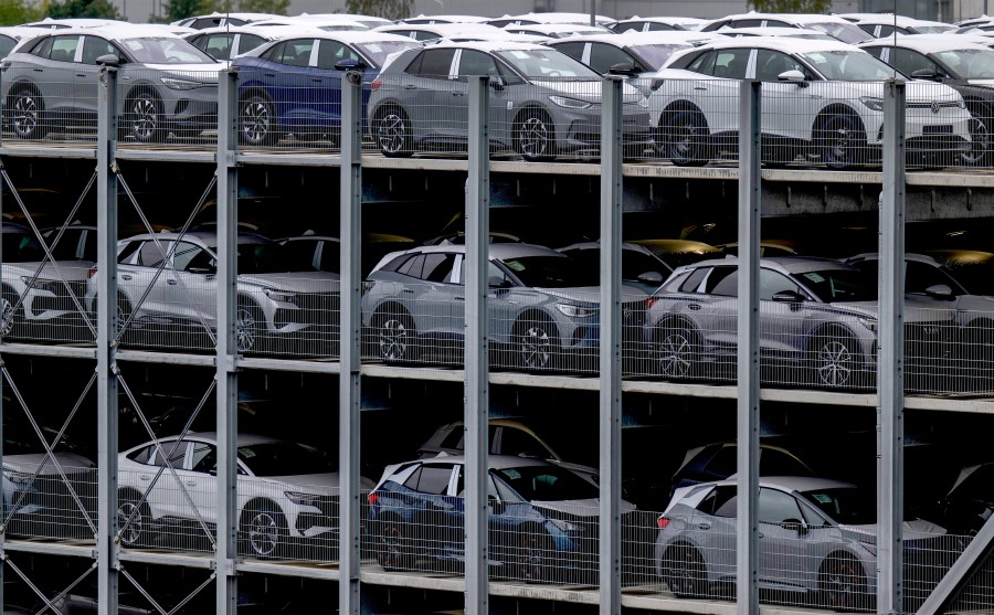 Electric vehicles produced by Volkswagen Saxony park before on the Zwickau plant premises in Zwickau, eastern Germany, Thursday, Sept. 14, 2023. The Zwickau plant has been a pioneer of electromobility at Volkswagen. In addition to the ID.3, ID.4 and ID.5 models, two models for Audi and one of the Cupra brand are also produced there. (Hendrik Schmidt/dpa via AP)