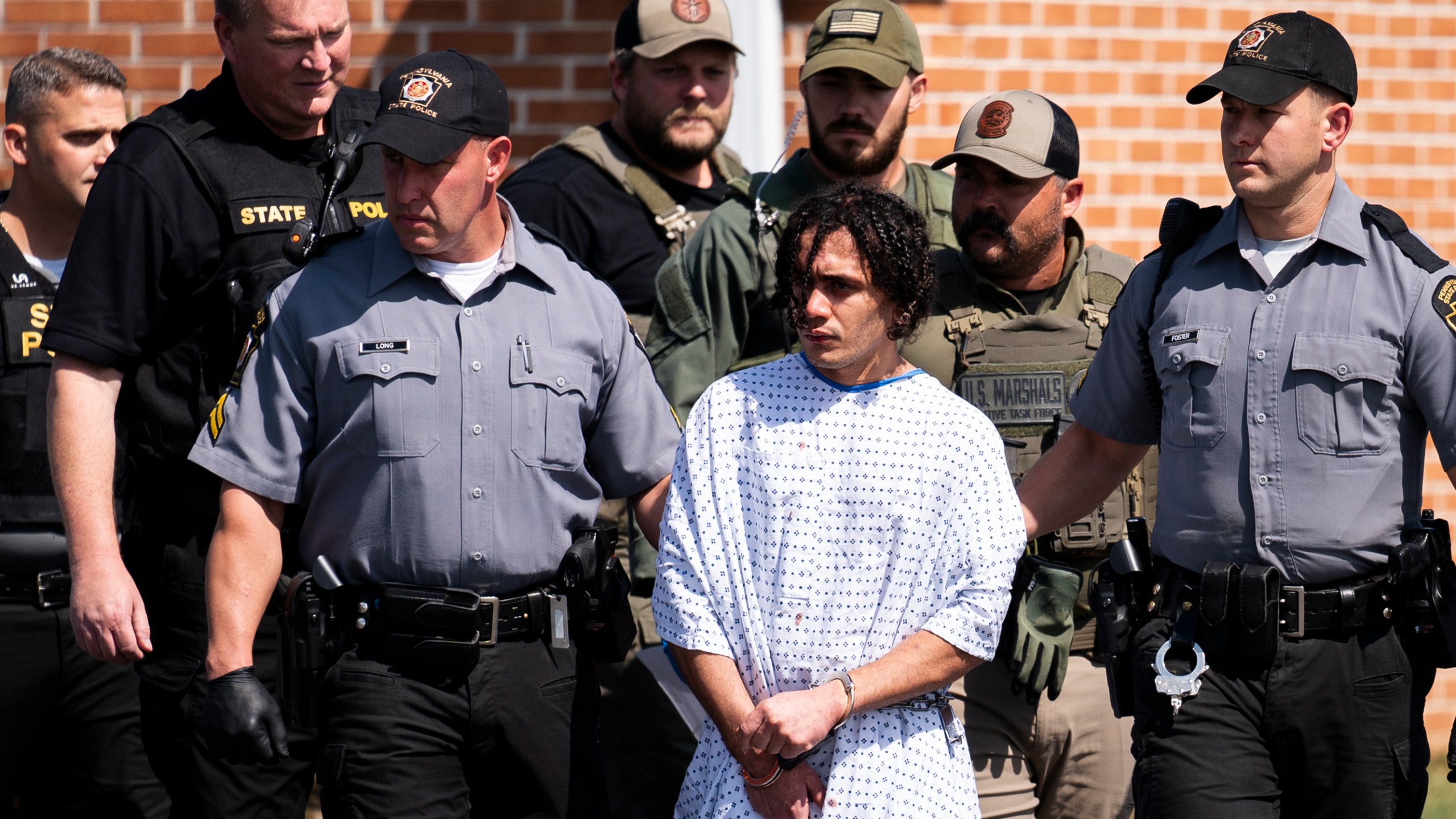 Law enforcement officers escort Danelo Cavalcante from a Pennsylvania State Police barracks in Avondale Pa., on Wednesday, Sept. 13, 2023. Cavalcante was captured Wednesday after eluding hundreds of searchers for two weeks. (AP Photo/Matt Rourke)