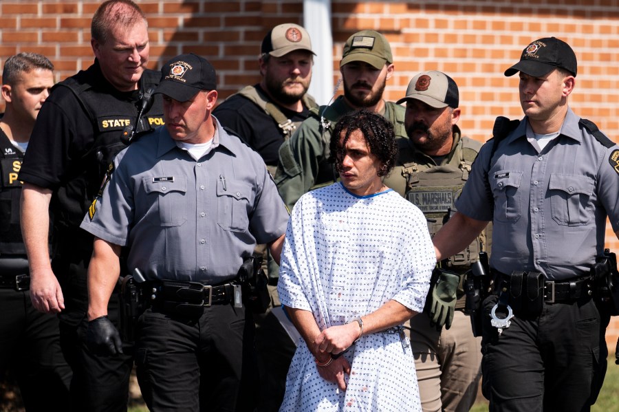 Law enforcement officers escort Danelo Cavalcante from a Pennsylvania State Police barracks in Avondale Pa., on Wednesday, Sept. 13, 2023. Cavalcante was captured Wednesday after eluding hundreds of searchers for two weeks. (AP Photo/Matt Rourke)