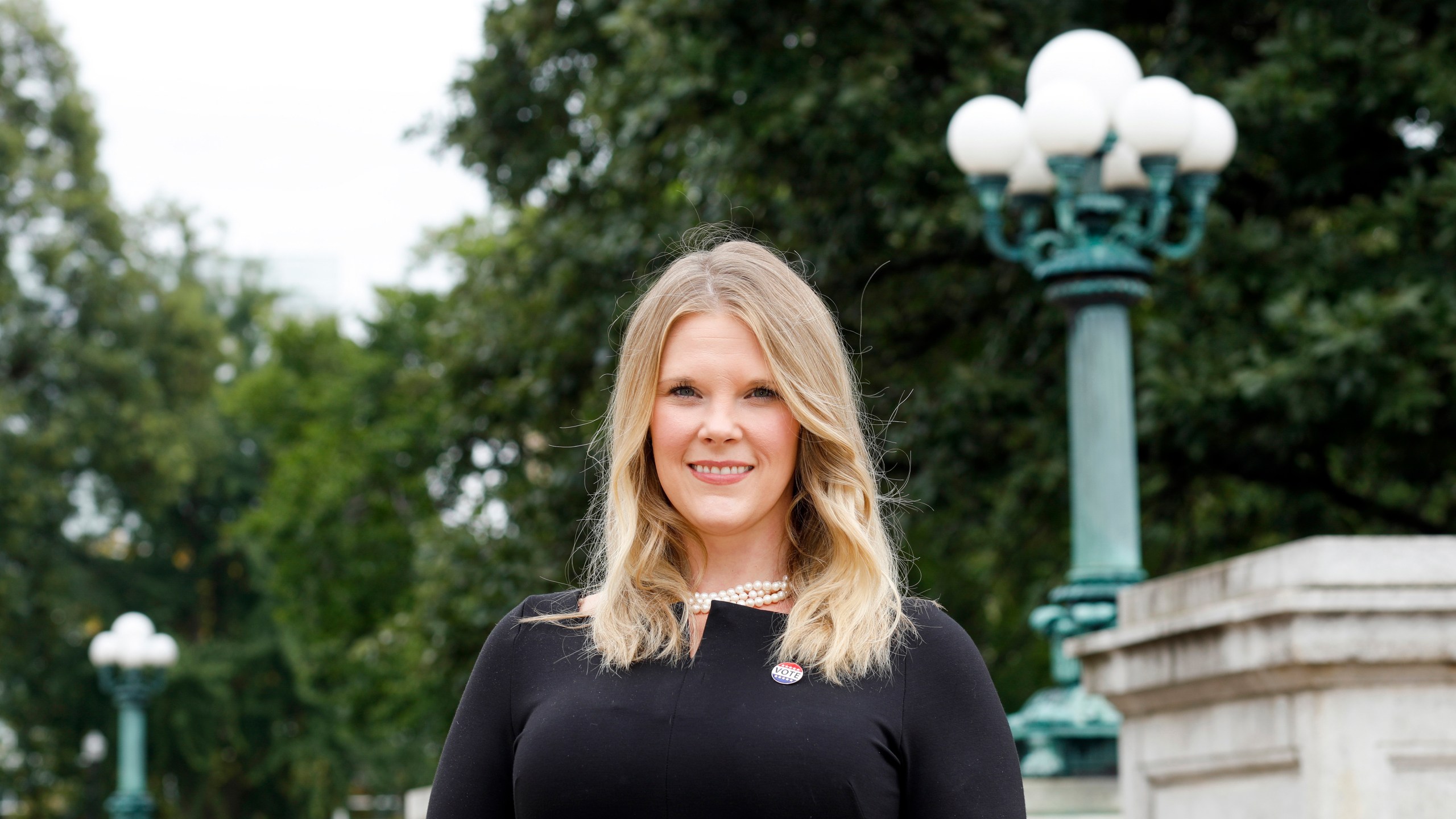 FILE - Wisconsin Elections Commission Administrator Meagan Wolfe poses for a photograph outside the Wisconsin Capitol building, Aug. 31, 2020, in Madison, Wis. The Republican-controlled Wisconsin Senate is set to vote Thursday, Sept. 14, 2023, on firing the battleground state's top elections official — a move that was denounced by Democrats and is expected to draw a legal battle. (Ruthie Hauge/Wisconsin State Journal via AP, File)