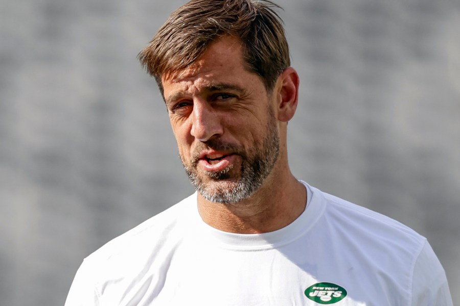 FILE - New York Jets quarterback Aaron Rodgers (8) practices before an NFL preseason football game against the New York Giants, Saturday, Aug. 26, 2023, in East Rutherford, N.J. Rodgers will make his first public media appearance, Friday, Sept. 15, since tearing the Achilles tendon in his left foot four snaps into his debut with his new team Monday night.(AP Photo/Adam Hunger, File)