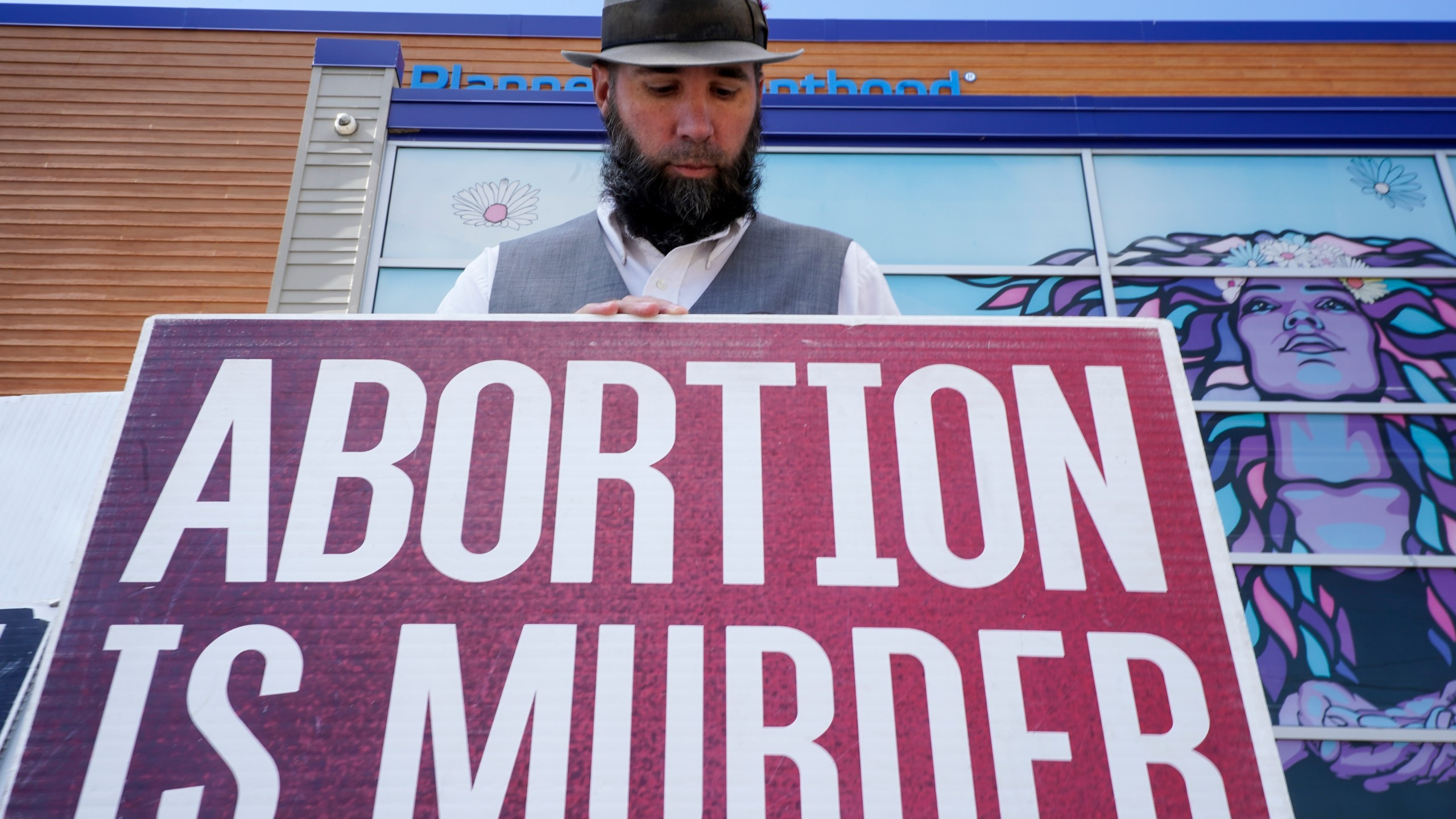 John Olkowski protests outside Planned Parenthood, Monday, Sept. 18, 2023, in Milwaukee. (AP Photo/Morry Gash)