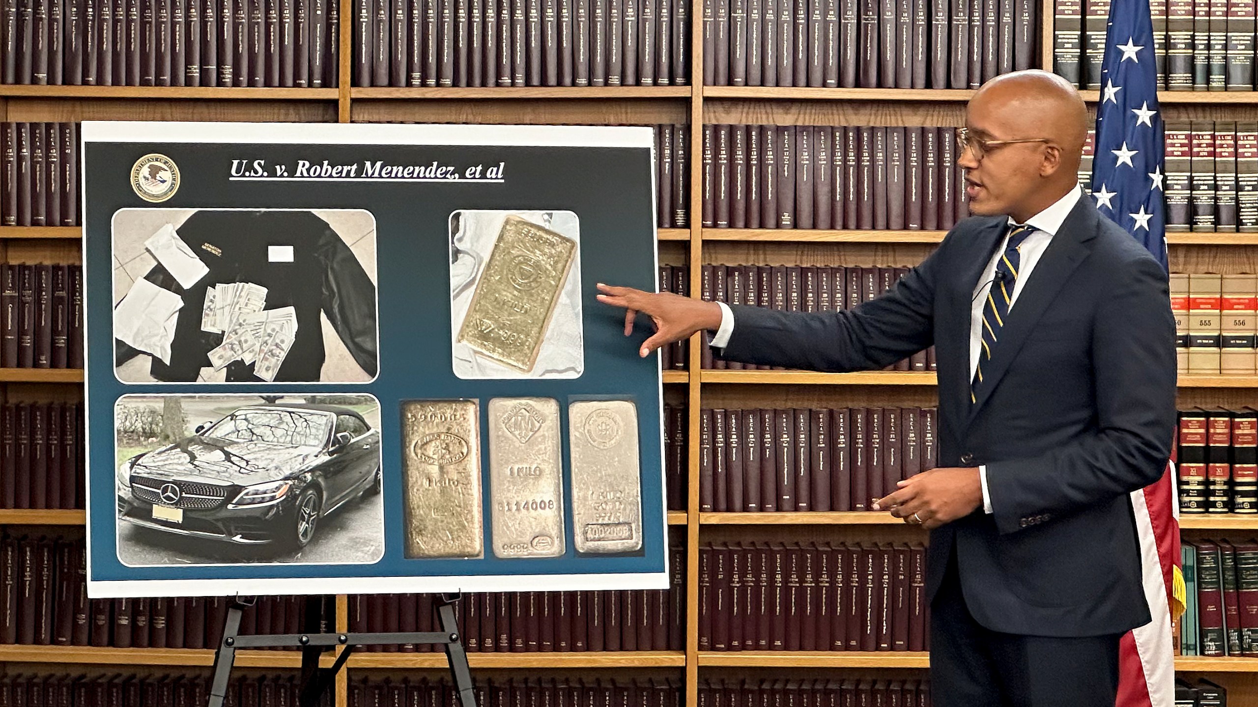 Damian Williams, U.S. Attorney for the Southern District of New York, talks about a display of photos of evidence in an indictment against Sen. Bob Menendez during a news conference, Friday, Sept. 22, 2023, in New York. Menendez of New Jersey and his wife have been indicted on charges of bribery. (AP Photo/Robert Bumsted)