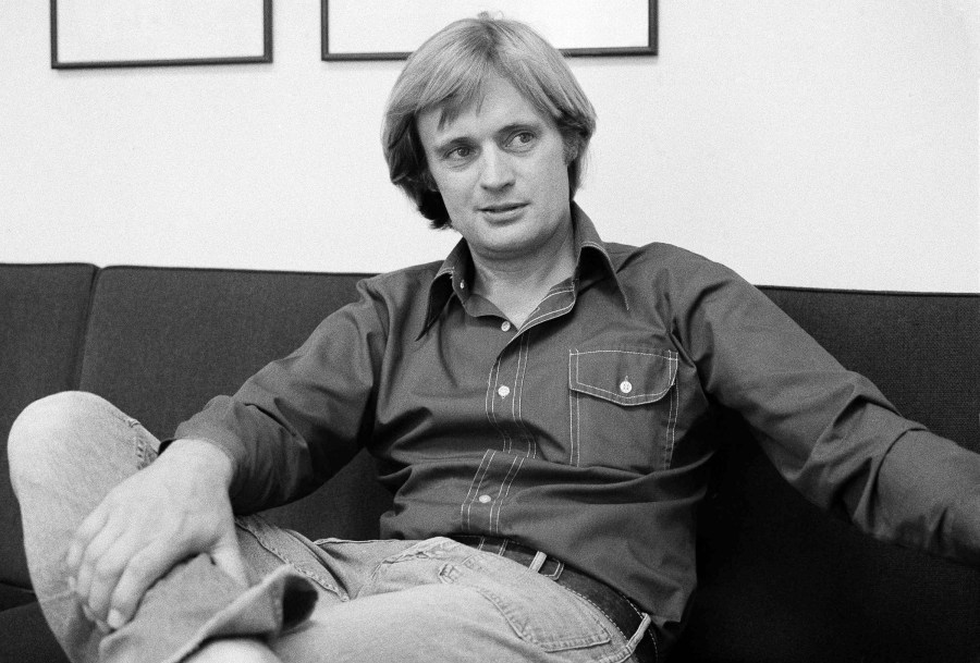 FILE - David McCallum, star of the NBC-TV series "The Invisible Man," is shown during an interview with Jay Sharbutt at NBC studios in New York, Aug. 28, 1975. McCallum, who became a teen heartthrob in the hit series "The Man From U.N.C.L.E." in the 1960s and was the eccentric medical examiner in the popular "NCIS" 40 years later, died on Monday, Sept. 25, 2023. He was 90. He died of natural causes surrounded by family at New York Presbyterian Hospital, CBS said in a statement. (AP Photo/Richard Drew, File)