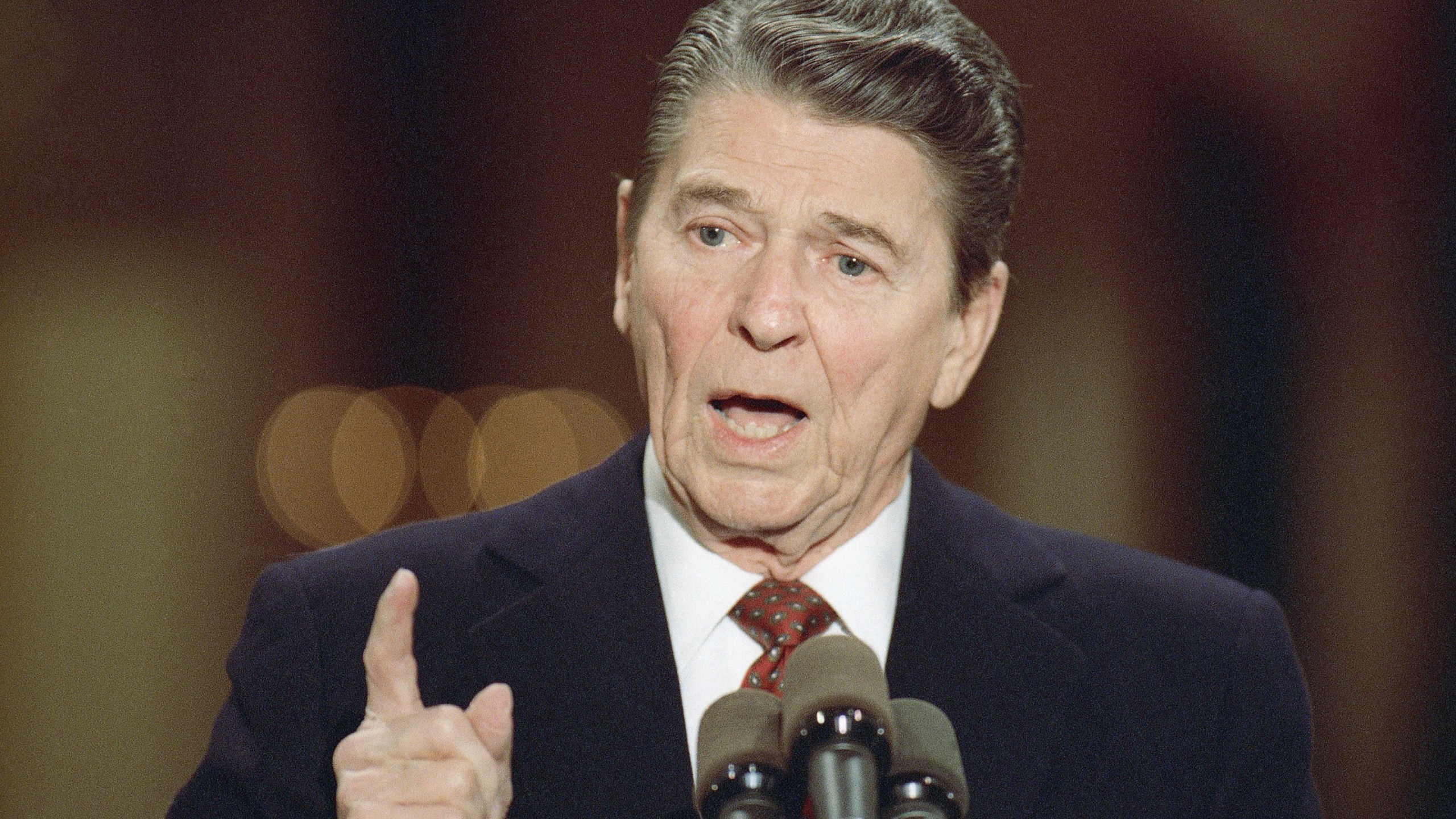 FILE - President Ronald Reagan speaks during a news conference in the East Room of the White House, Dec. 8, 1988, in Washington. As most Republican White House hopefuls gather Wednesday at Reagan’s presidential library for a debate, expect to hear more homages to the “Great Communicator.” (AP Photo/Doug Mills, File)