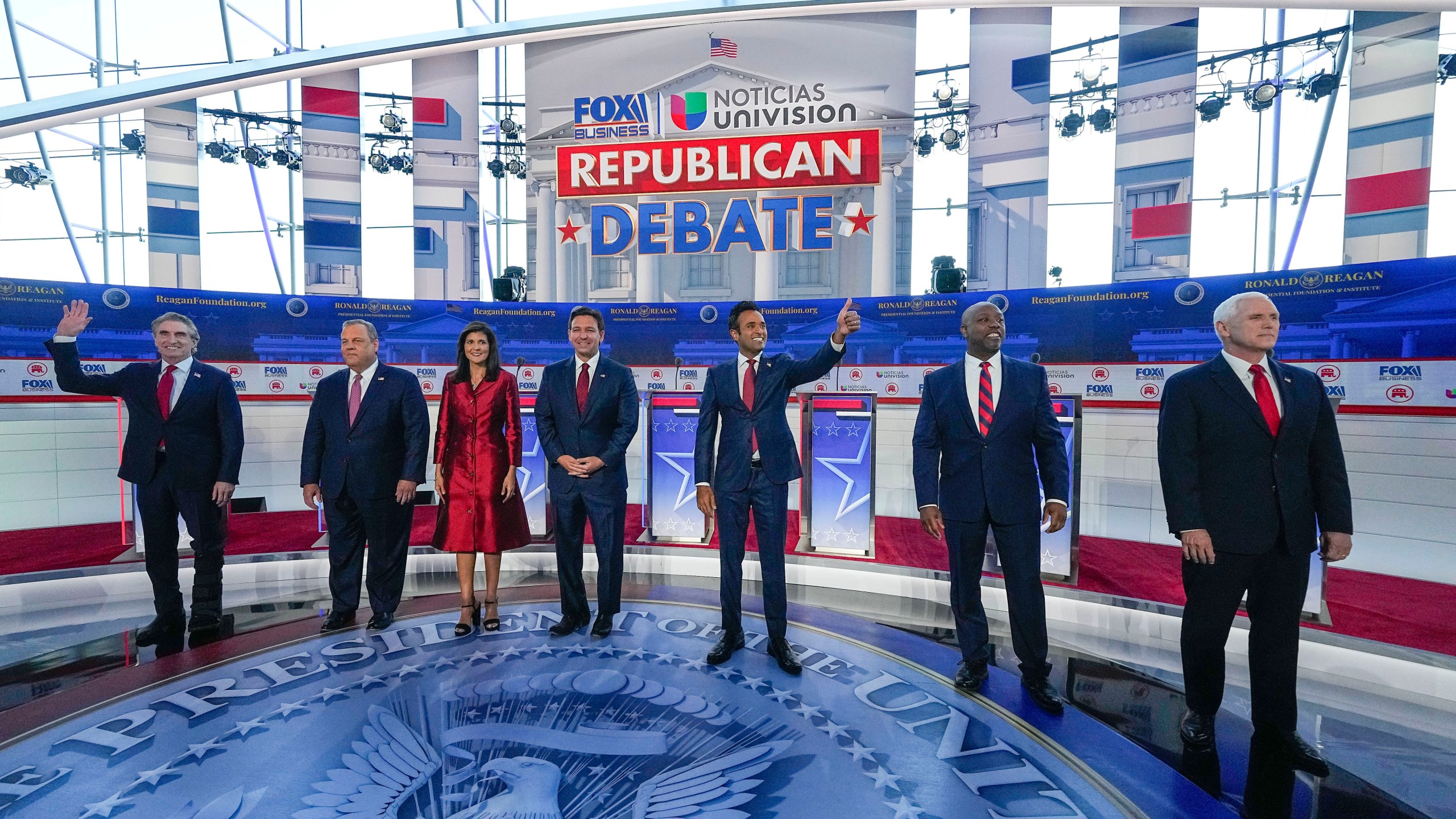 Republican presidential candidates, from left, North Dakota Gov. Doug Burgum, former New Jersey Gov. Chris Christie, former U.N. Ambassador Nikki Haley, Florida Gov. Ron DeSantis, entrepreneur Vivek Ramaswamy, Sen. Tim Scott, R-S.C., and former Vice President Mike Pence, before the start of a Republican presidential primary debate hosted by FOX Business Network and Univision, Wednesday, Sept. 27, 2023, at the Ronald Reagan Presidential Library in Simi Valley, Calif. (AP Photo/Mark Terrill)