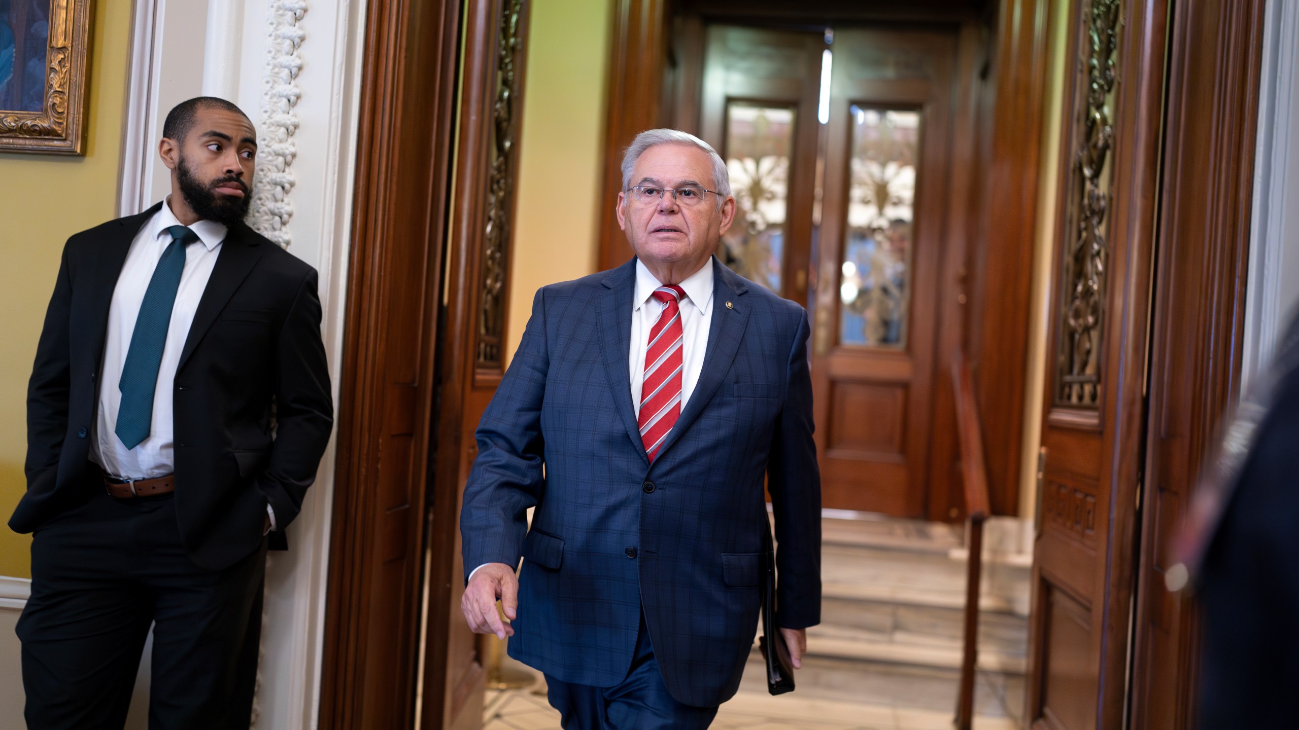 Sen. Bob Menendez, D-N.J., walks from the chamber to a closed-door meeting of the Senate Democratic Caucus to address his colleagues for the first time since he was indicted on federal bribery charges at the Capitol in Washington, Thursday, Sept. 28, 2023. (AP Photo/J. Scott Applewhite)