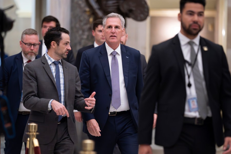 FILE - House Speaker Kevin McCarthy, R-Calif., walks to the chamber for procedural votes to advance appropriations bills, at the Capitol in Washington, Tuesday night, Sept. 26, 2023. McCarthy is digging in on his refusal to take up Senate legislation designed to keep the federal government fully running beyond midnight Saturday, Sept. 30. (AP Photo/J. Scott Applewhite, File)