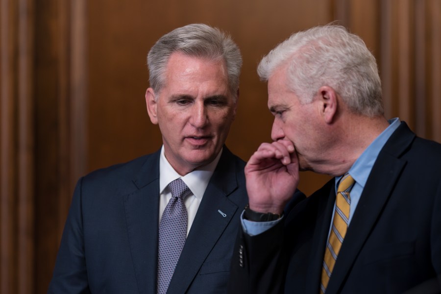 Speaker of the House Kevin McCarthy, R-Calif., confers with Majority Whip Tom Emmer, R-Minn., right, just after the House approved a 45-day funding bill to keep federal agencies open, but the measure must first go to the Senate, at the Capitol in Washington, Saturday, Sept. 30, 2023. (AP Photo/J. Scott Applewhite)