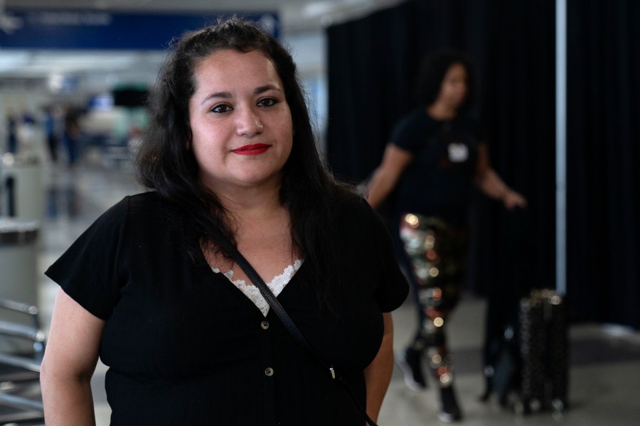 Vianney Marzullo, lead volunteer with the Police Station Response Team organization, stands by a makeshift shelter for migrants at O'Hare International Airport run by a private firm hired by the city, Wednesday, Sept. 20, 2023, in Chicago. (AP Photo/Erin Hooley)