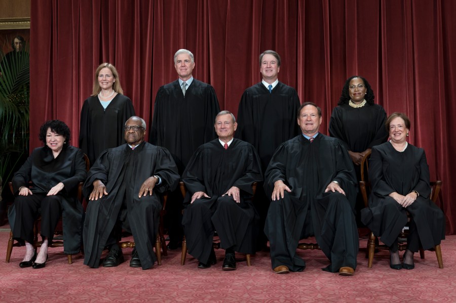 FILE - Members of the Supreme Court sit for a new group portrait following the addition of Associate Justice Ketanji Brown Jackson, at the Supreme Court building in Washington, Oct. 7, 2022. Bottom row, from left, Justice Sonia Sotomayor, Justice Clarence Thomas, Chief Justice John Roberts, Justice Samuel Alito, and Justice Elena Kagan. Top row, from left, Justice Amy Coney Barrett, Justice Neil Gorsuch, Justice Brett Kavanaugh, and Justice Ketanji Brown Jackson. The new term of the high court begins next Monday, Oct. 2, 2023. (AP Photo/J. Scott Applewhite, File)