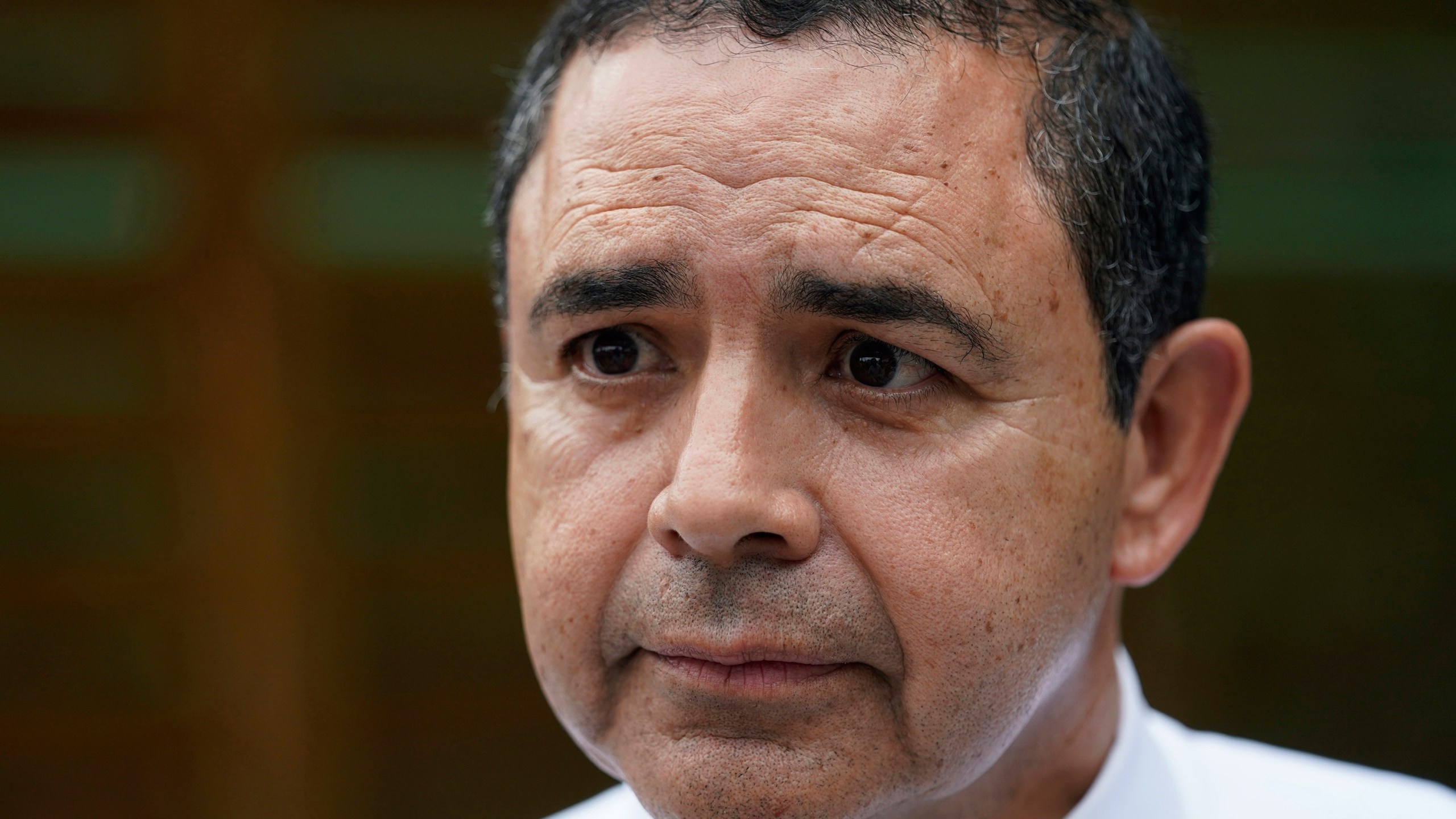 FILE - U.S. Rep. Henry Cuellar, D-Texas, talks to a member of the media during a campaign event in San Antonio, May 4, 2022. Cuellar was carjacked late Monday, Oct. 2, 2023, in Washington's Navy Yard area, about a mile from the U.S. Capitol, multiple media sources reported. (AP Photo/Eric Gay, File)