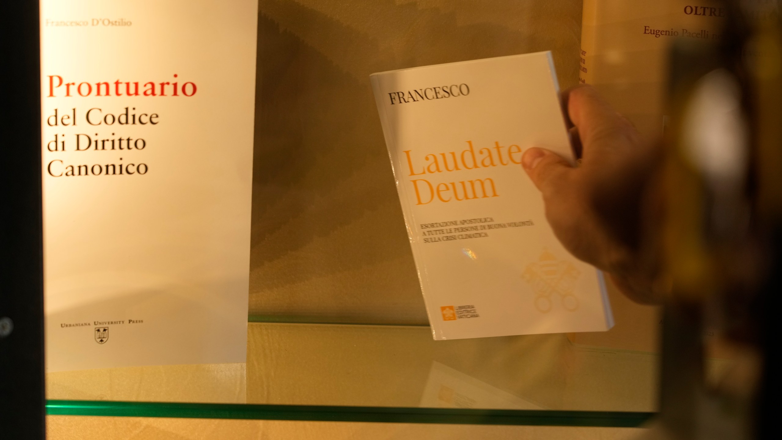 Copies of Pope Francis' latest encyclical letter on environment "Laudate Deum" are prepared for sale in a bookshop in Rome, Wednesday, Oct. 4, 2023. Pope Francis shamed and challenged world leaders on Wednesday to commit to binding targets to slow climate change before it's too late, warning that God's increasingly warming creation is fast reaching a "point of no return." (AP Photo/Andrew Medichini)