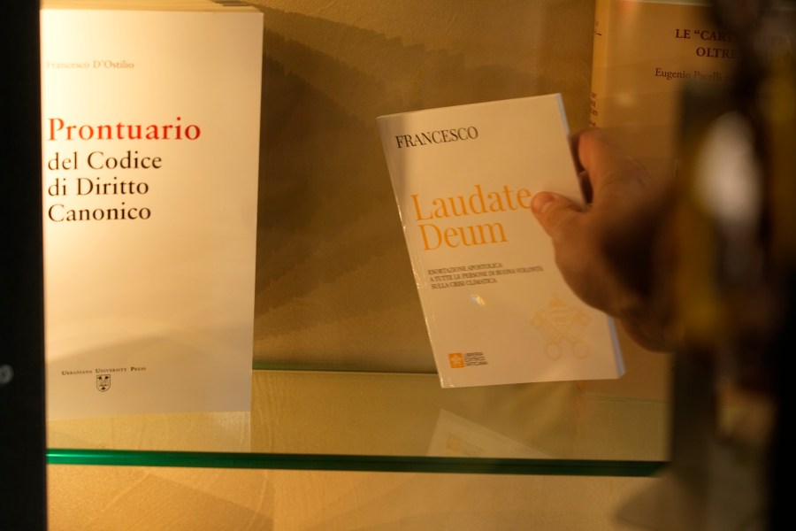 Copies of Pope Francis' latest encyclical letter on environment "Laudate Deum" are prepared for sale in a bookshop in Rome, Wednesday, Oct. 4, 2023. Pope Francis shamed and challenged world leaders on Wednesday to commit to binding targets to slow climate change before it's too late, warning that God's increasingly warming creation is fast reaching a "point of no return." (AP Photo/Andrew Medichini)