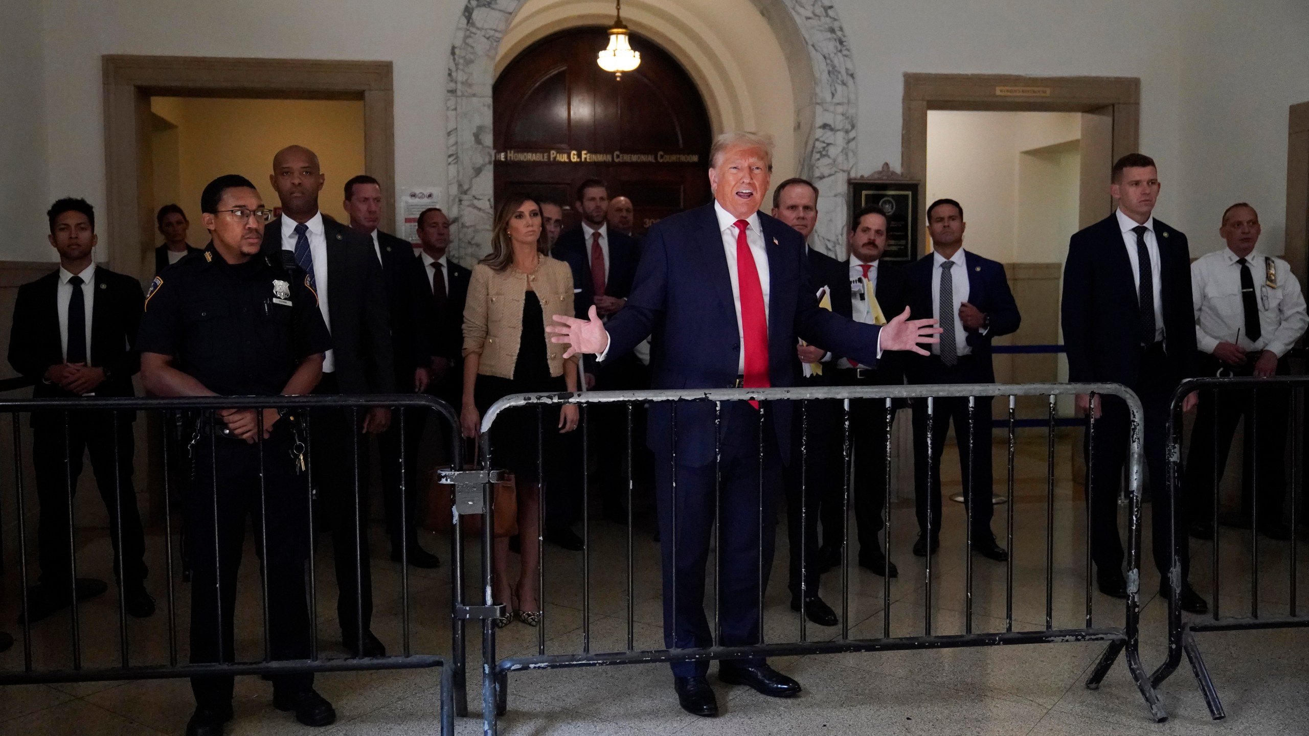 Former President Donald Trump speaks to reporters as he leaves the courtroom during a lunch break in his civil business fraud trial, Wednesday, Oct. 4, 2023, in New York. (AP Photo/Mary Altaffer)