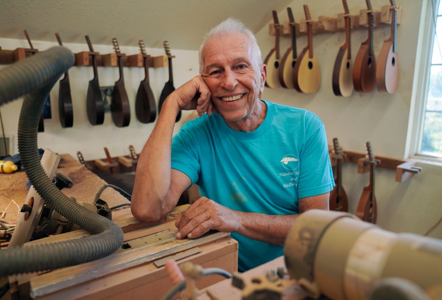 Mike Dulak sits for a portrait in his mandolin workshop in Rocheport, Mo., Friday, Sept. 8, 2023. Dulak does not associate with any religious group and self-identifies as "nothing in particular" when asked about his beliefs. He is part of the largest growing group of nonbelievers in the United States today, as nearly one in six adults claim the label "nothing in particular" according to the Associated Press- NORC Center for Public Affairs Research. (AP Photo/Jessie Wardarski)