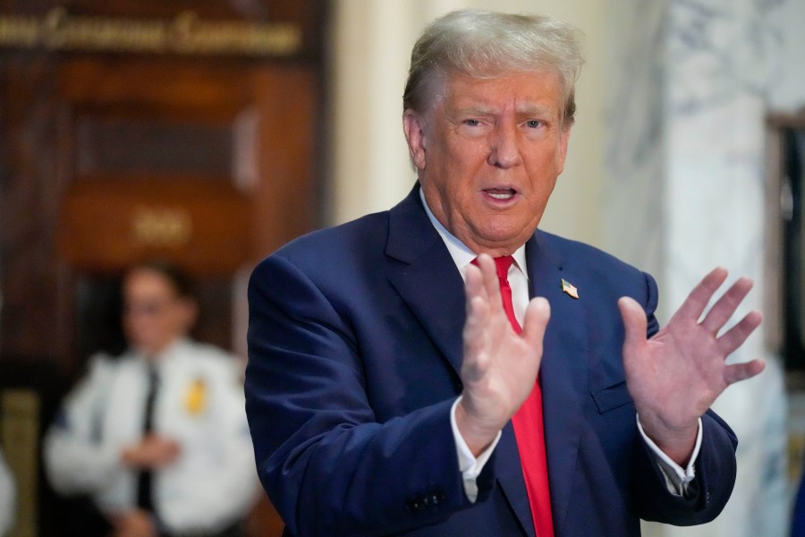 Former President Donald Trump speaks to the media before entering the courtroom at New York Supreme Court, Wednesday, Oct. 4, 2023, in New York. (AP Photo/Mary Altaffer)