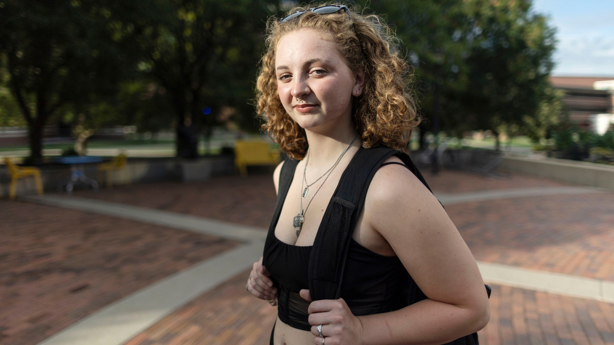 Stella Gage, 19, a sophomore psychology and sociology major at Wichita State University, stands on the campus in Wichita, Kan., on Sept. 26, 2023. As public schools in the U.S. are faced with new guidelines and laws around health and sex education, many queer students are recalling their experience and what they hope to see taught in their classrooms. (AP Photo/Travis Heying)