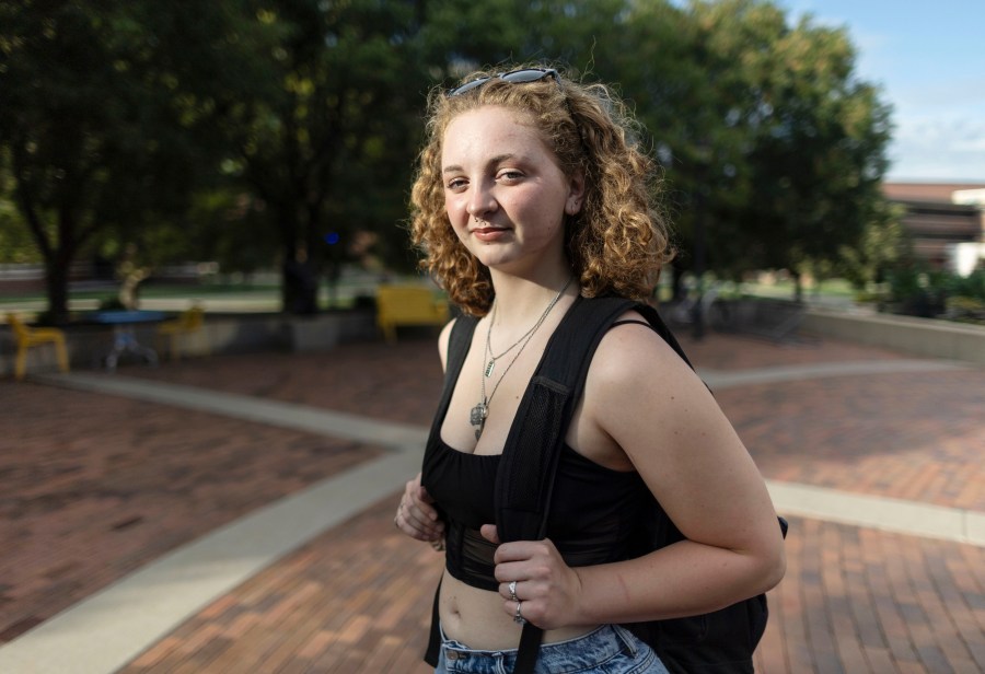 Stella Gage, 19, a sophomore psychology and sociology major at Wichita State University, stands on the campus in Wichita, Kan., on Sept. 26, 2023. As public schools in the U.S. are faced with new guidelines and laws around health and sex education, many queer students are recalling their experience and what they hope to see taught in their classrooms. (AP Photo/Travis Heying)