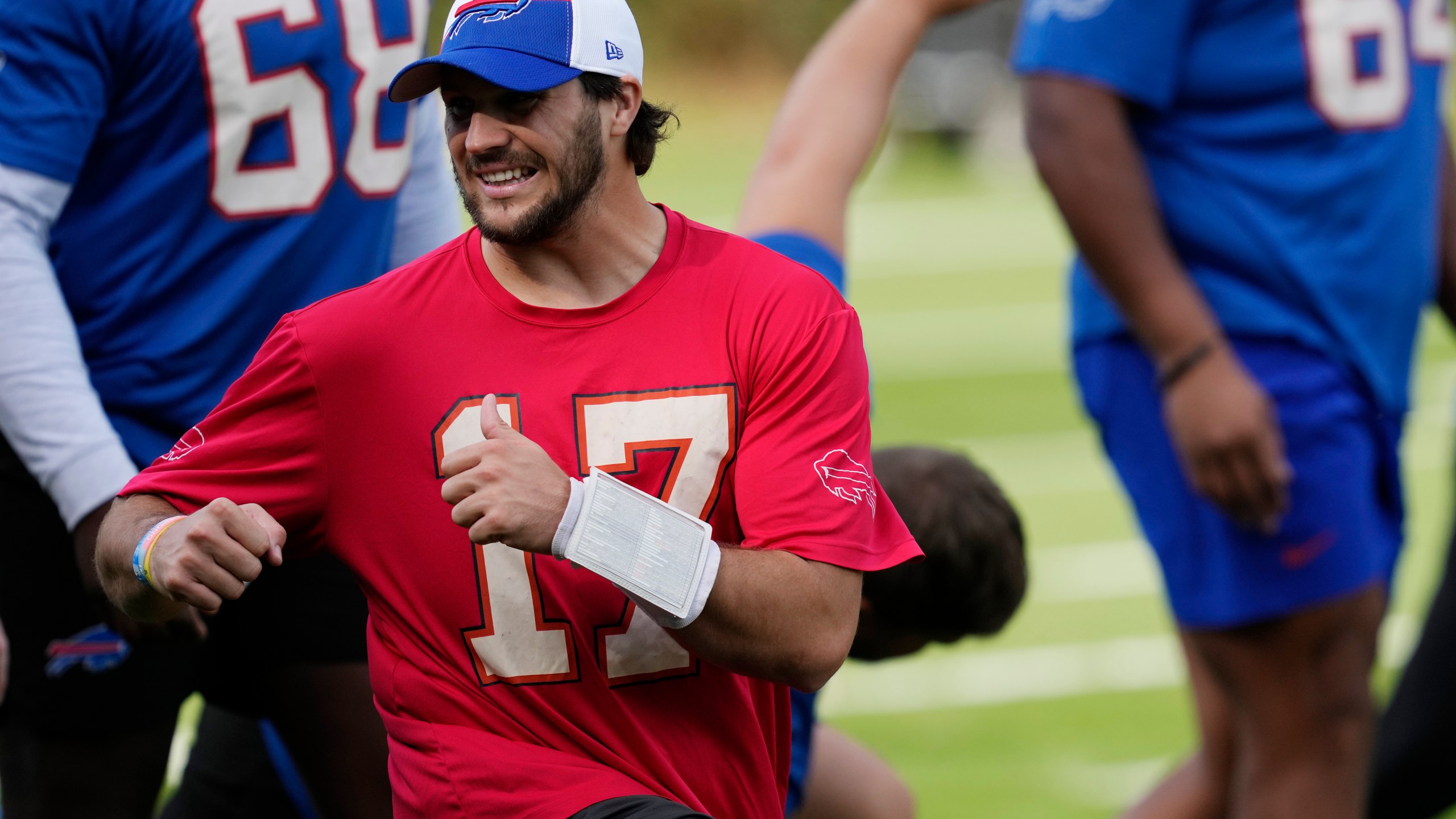 Buffalo Bills quarterback Josh Allen (17) warms up during a practice session in Watford, Hertfordshire, England, north-west of London, Friday, Oct. 6, 2023. The Buffalo Bills will take on the Jacksonville Jaguars in a regular season game at Tottenham Hotspur Stadium on Sunday. (AP Photo/Steve Luciano)