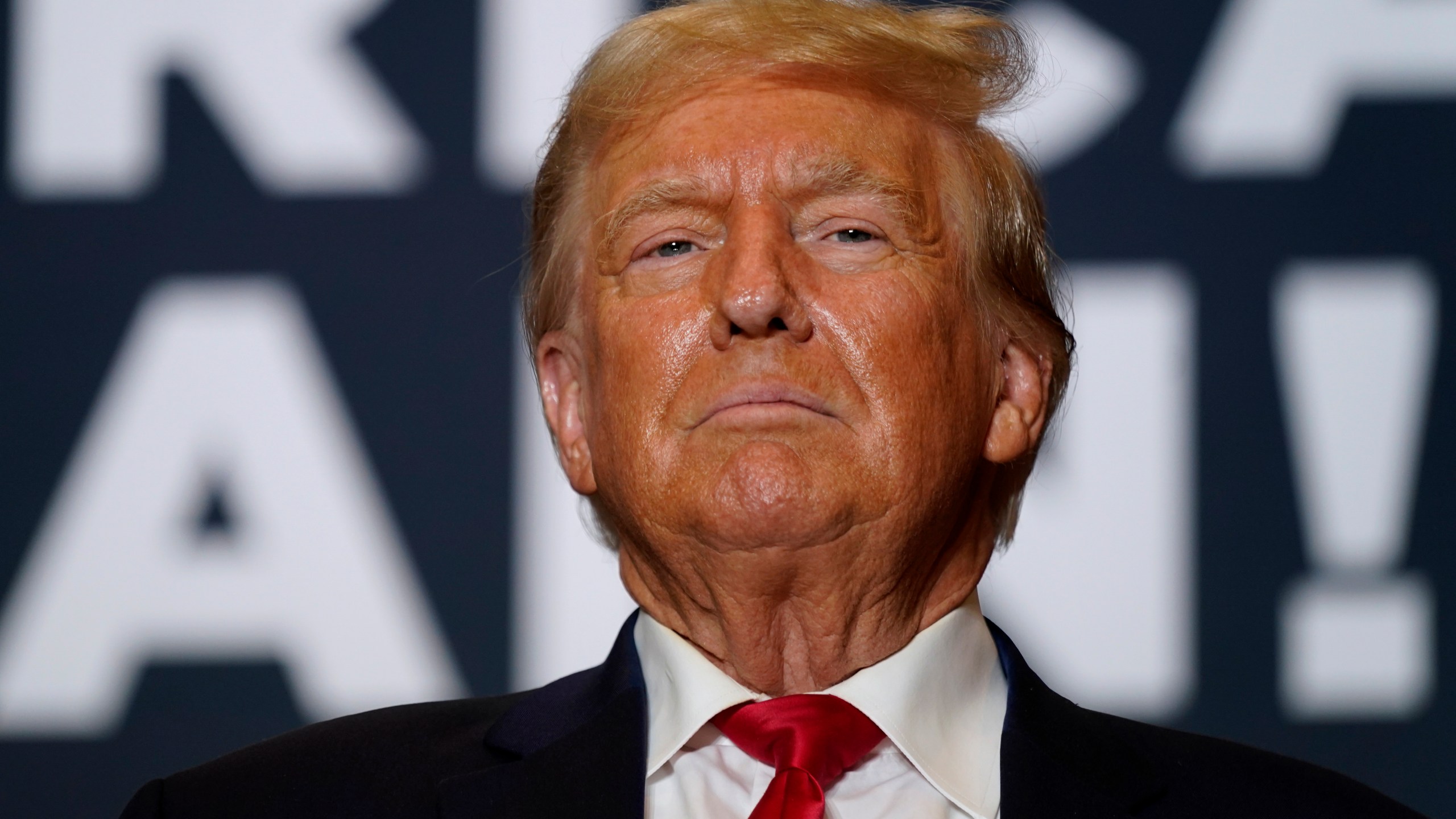 FILE - Former President Donald Trump arrives at a commit to caucus rally, Saturday, Oct. 7, 2023, in Cedar Rapids, Iowa. Trump, the Republican front-runner and long the person who has shaped his party's rhetoric on the border, has often blamed Mexico for problems in the U.S. and promises new uses of military force and covert action if he returns to the White House. (AP Photo/Charlie Neibergall, File)