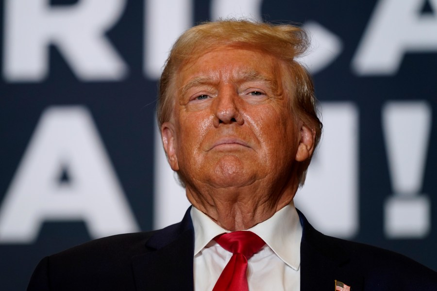 FILE - Former President Donald Trump arrives at a commit to caucus rally, Saturday, Oct. 7, 2023, in Cedar Rapids, Iowa. Trump, the Republican front-runner and long the person who has shaped his party's rhetoric on the border, has often blamed Mexico for problems in the U.S. and promises new uses of military force and covert action if he returns to the White House. (AP Photo/Charlie Neibergall, File)