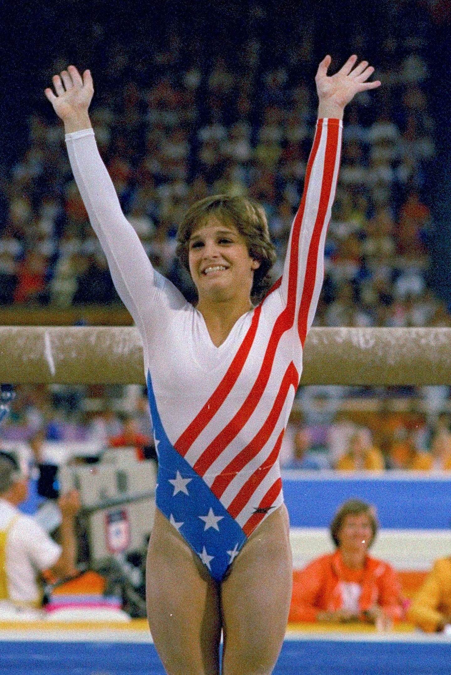 FILE- Mary Lou Retton reacts to applause after her performance at the Summer Olympics in Los Angeles on Aug. 3, 1984. Retton. 55, is in intensive care in a Texas hospital fighting a rare form of pneumonia, according to her daughter McKenna Kelley. (AP Photo/Suzanne Vlamis, File)