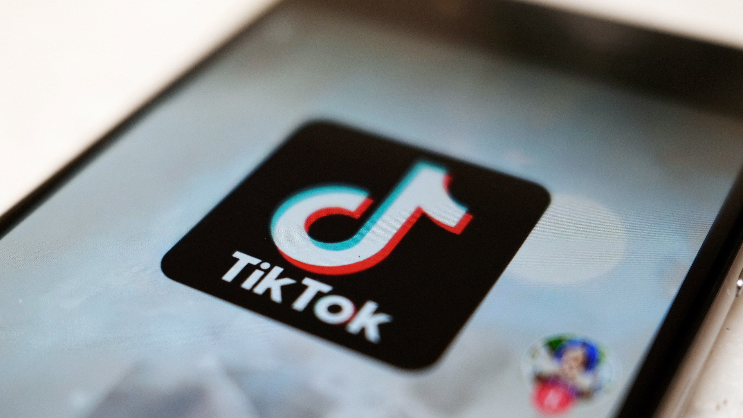 FILE - The TikTok logo is displayed on a smartphone screen, Sept. 28, 2020, in Tokyo. A federal judge is scheduled to hear arguments Thursday, Oct. 12, 2023, in a case filed by TikTok and five Montana content creators who want the court to block the state’s ban on the video sharing app before it takes effect Jan. 1. (AP Photo/Kiichiro Sato, File)