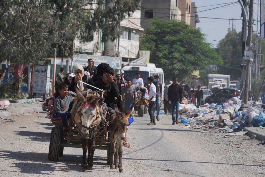 Palestinians fleeing from northern Gaza to the south after the Israeli army issued an unprecedented evacuation warning to a population of over 1 million people in northern Gaza and Gaza City to seek refuge in the south ahead of a possible Israeli ground invasion, Friday, Oct. 13, 2023. (AP Photo/Hatem Moussa)