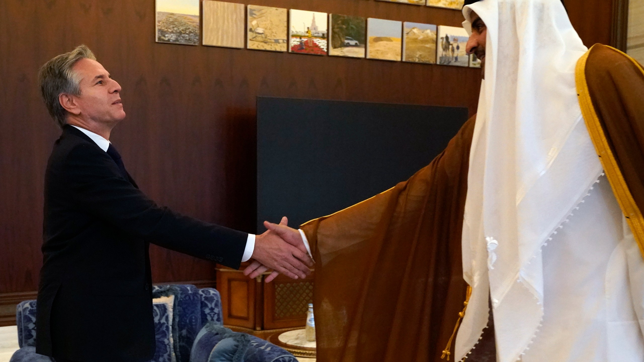 U.S. Secretary of State Antony Blinken, left, and Qatari Emir Sheikh Tamim bin Hamad Al Thani shake hands before their meeting in Lusail, Qatar, Friday Oct. 13, 2023. (AP Photo/Jacquelyn Martin, Pool)