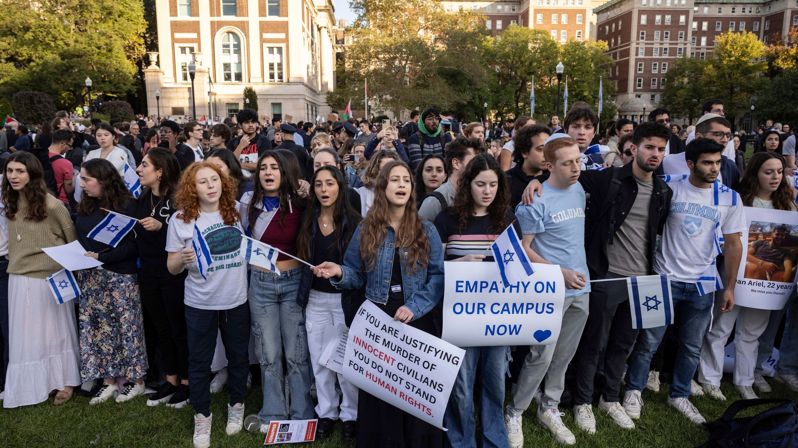 FILE - Pro-Israel demonstrators sing a song during a protest at Columbia University, Thursday, Oct. 12, 2023, in New York. As the death toll rises in the Israel-Hamas war, American colleges have become seats of anguish with many Jewish students calling for strong condemnation after civilian attacks by Hamas while some Muslim students are pressing for recognition of decades of suffering by Palestinians in Gaza. (AP Photo/Yuki Iwamura, File)