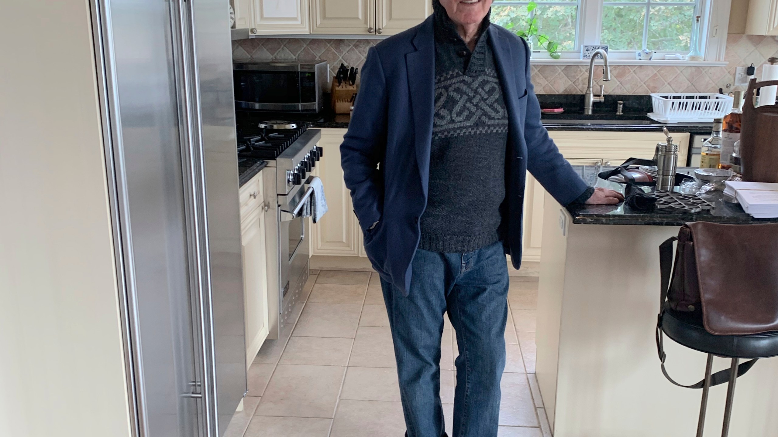 This undated photo provided by Jane Friedman shows Stephen Rubin posing for a picture in his kitchen in West Hampton, N.Y., Rubin, a longtime publishing executive with an eye for bestsellers and a passion for music and public life who helped launched the career of John Grisham, among others, and released such blockbusters as “The Da Vinci Code” and “Fire and Fury,” has died, Friday, Oct. 13, 2023. He was 81. (Jane Friedman via AP)