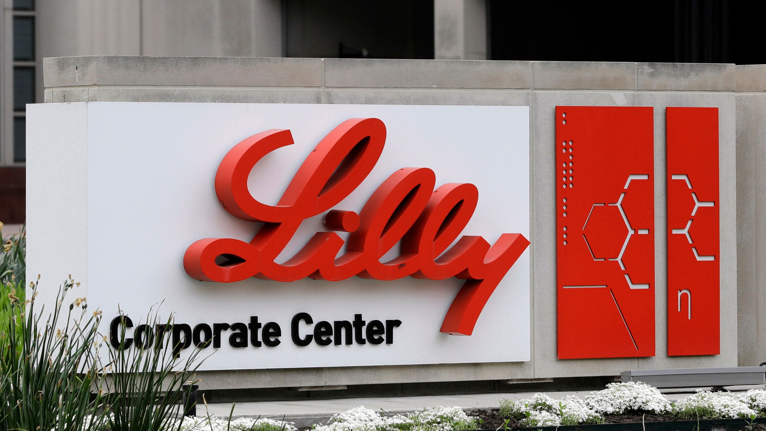 FILE - A sign for Eli Lilly & Co. stands outside their corporate headquarters in Indianapolis on April 26, 2017. A new study finds that the medicine in the diabetes drug Mounjaro helped people with obesity or who are overweight lose at least a quarter of their body weight. (AP Photo/Darron Cummings, File)