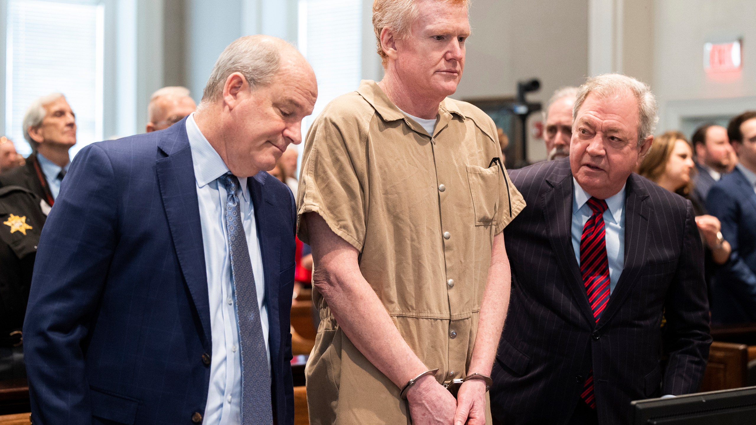 FILE - Alex Murdaugh speaks with his legal team before he is sentenced to two consecutive life sentences for the murder of his wife and son by Judge Clifton Newman at the Colleton County Courthouse on Friday, March 3, 2023 in in Walterboro, S.C. Murdaugh's lawyers have filed court papers that he plans to plead guilty in federal court to charges he stole money from clients. (Joshua Boucher/The State via AP, File, Pool)