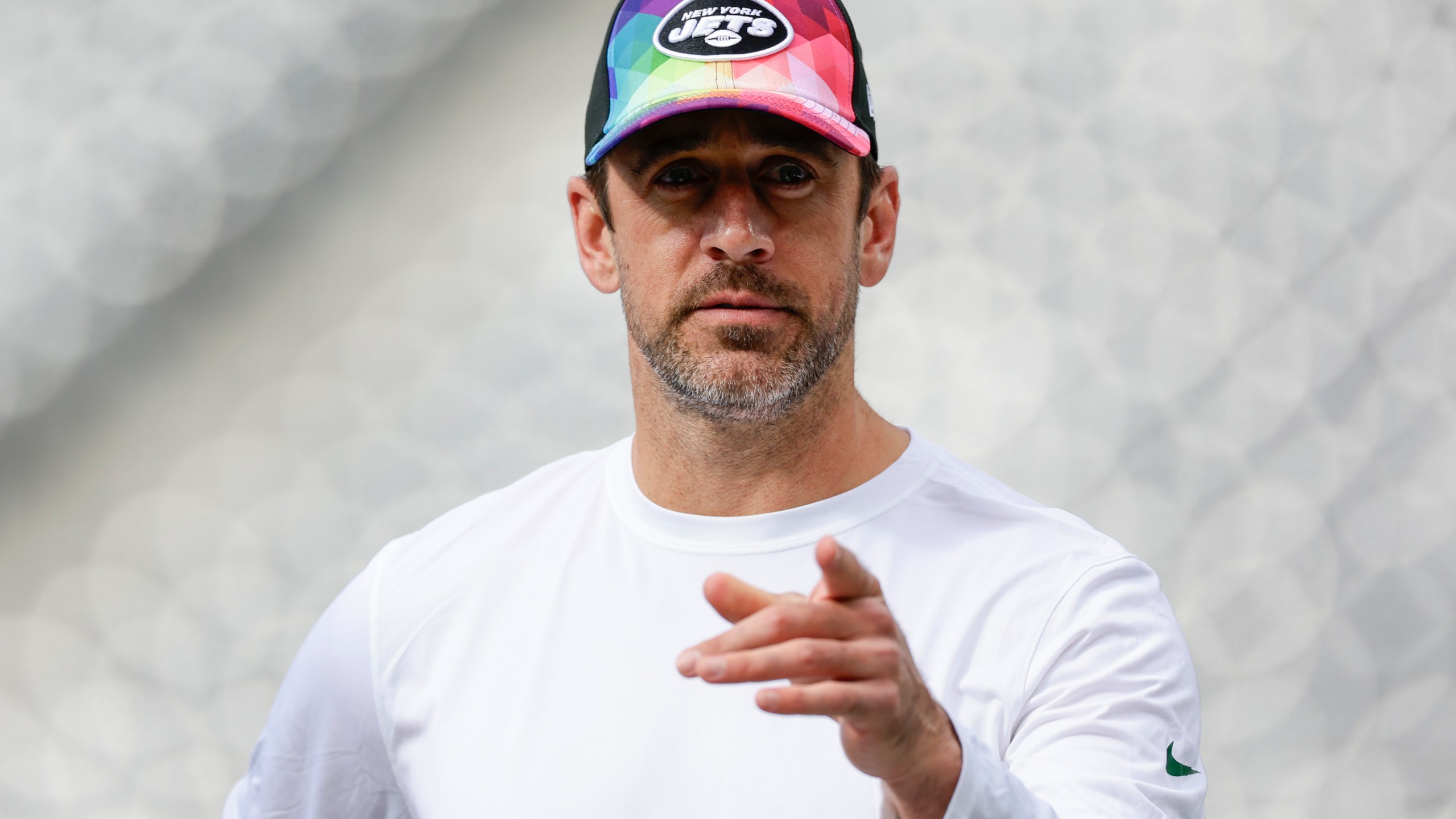 New York Jets quarterback Aaron Rodgers walks on the field before an NFL football game against the Philadelphia Eagles, Sunday, Oct. 15, 2023, in East Rutherford, N.J. (AP Photo/Adam Hunger)