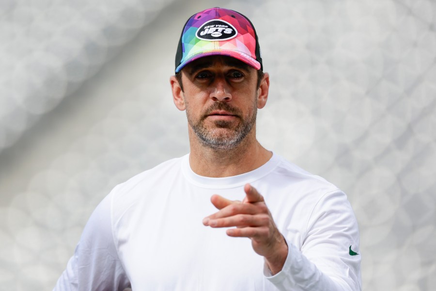 New York Jets quarterback Aaron Rodgers walks on the field before an NFL football game against the Philadelphia Eagles, Sunday, Oct. 15, 2023, in East Rutherford, N.J. (AP Photo/Adam Hunger)