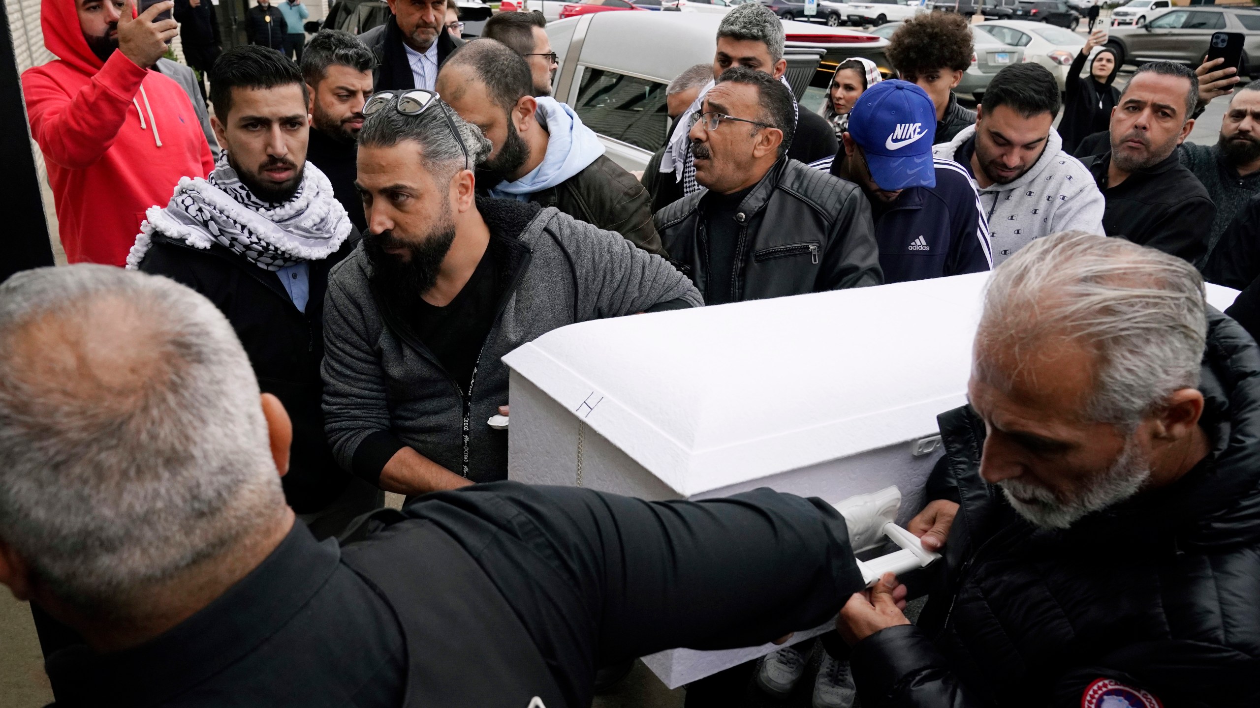 Family members of Wadea Al Fayoume bring his casket into Mosque Foundation in Bridgeview, Ill., Monday, Oct. 16, 2023. An Illinois landlord accused of fatally stabbing the 6-year-old Muslim boy and seriously wounding his mother was charged with a hate crime after police and relatives said he singled out the victims because of their faith and as a response to the war between Israel and Hamas. (AP Photo/Nam Y. Huh)